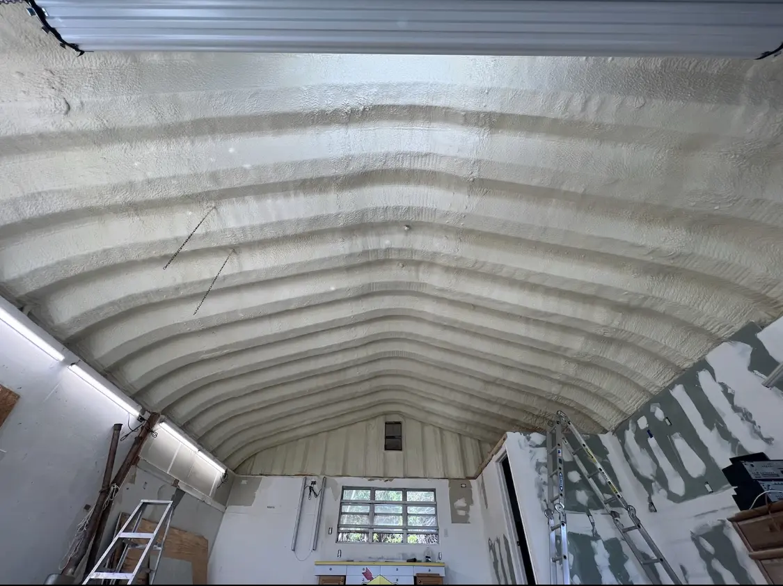 Spray polyurethane foam applied to the underside of a metal roof deck in West Clarkston-Highland
